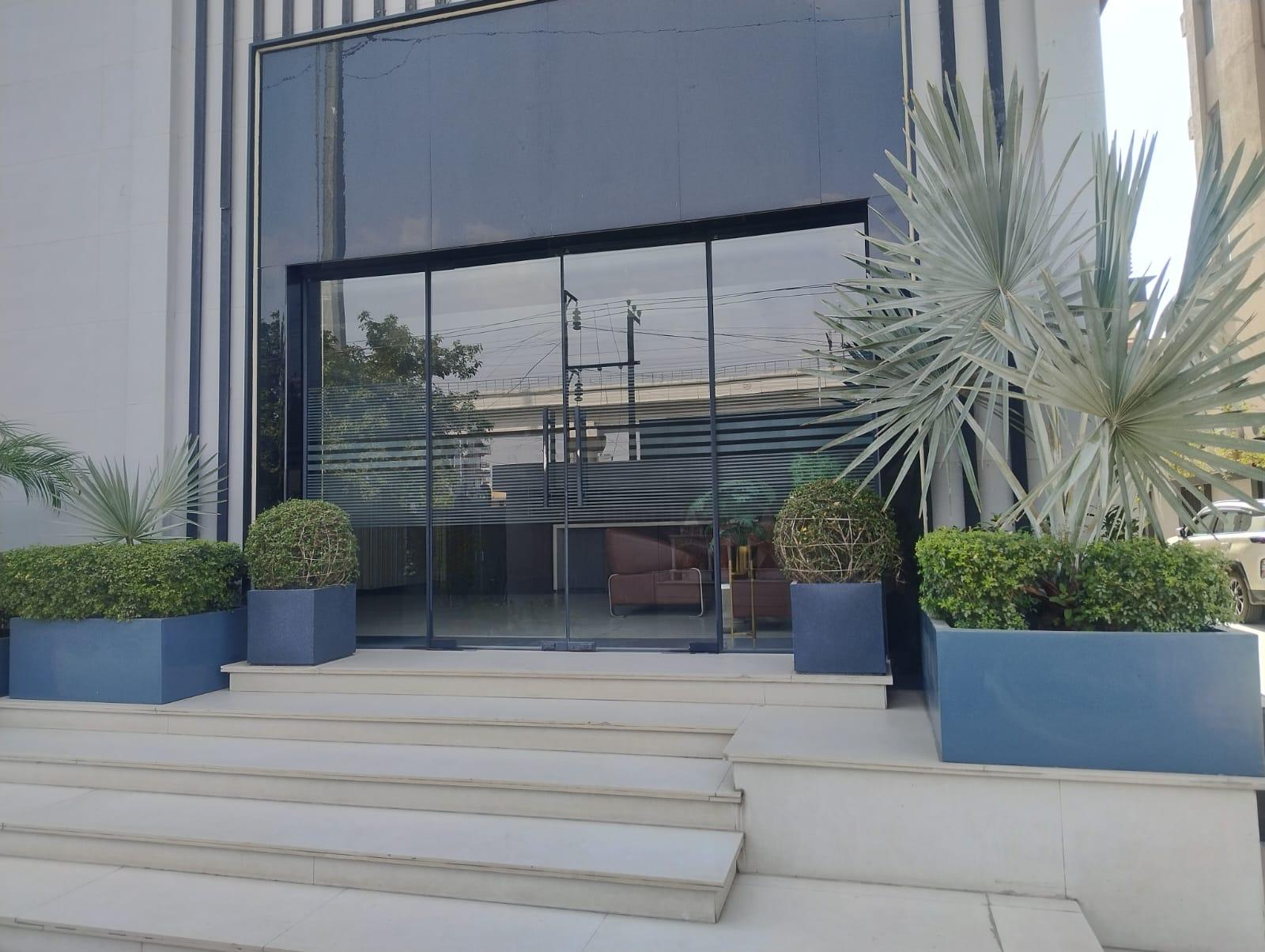 Goldmine Developers — modern glass commercial facade